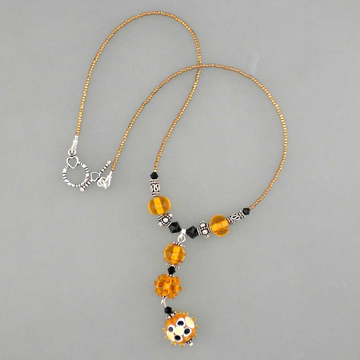 handmade lampwork amber necklace