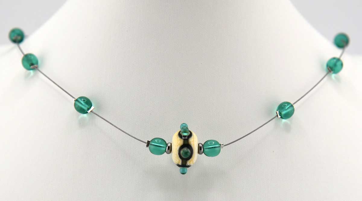 ivory and green lampwork floating necklace