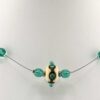 green and ivory lampwork floating necklace